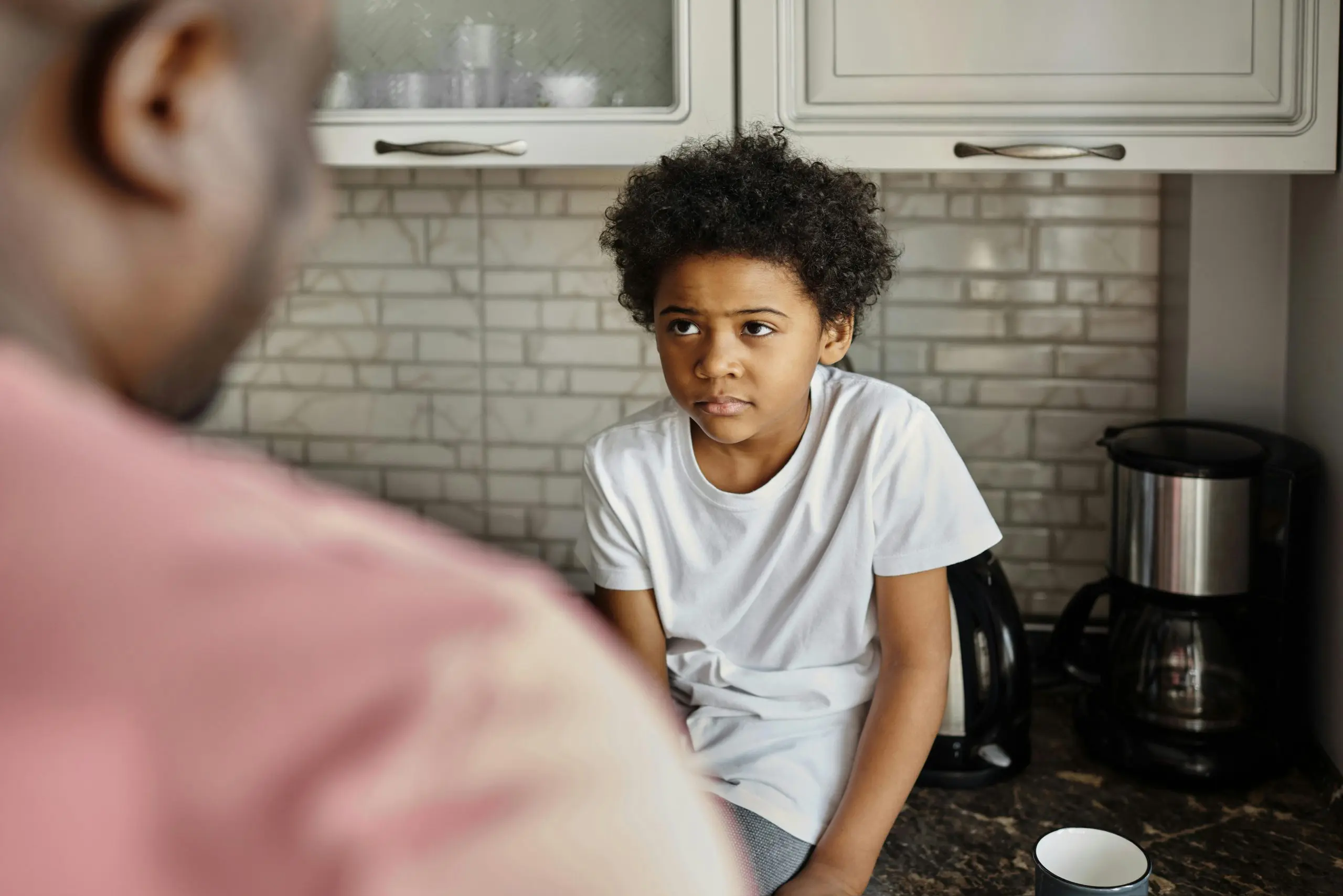 Child looking at adult