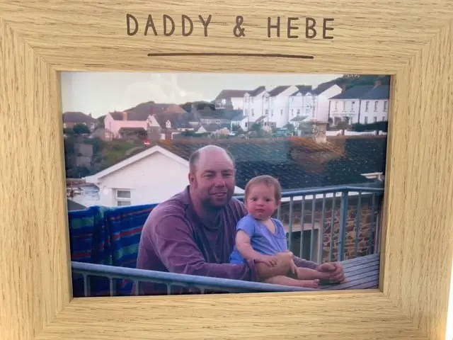 Hebe and dad 2 Hebe as a baby with her dad in a wooden frame with Daddy and Hebe written on