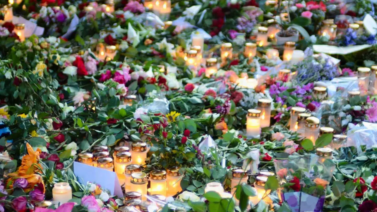 Flowers and candles laid as tribute to a celebrity