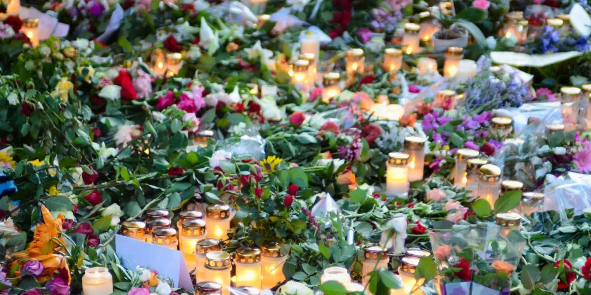 Flowers and candles laid as tribute to a celebrity