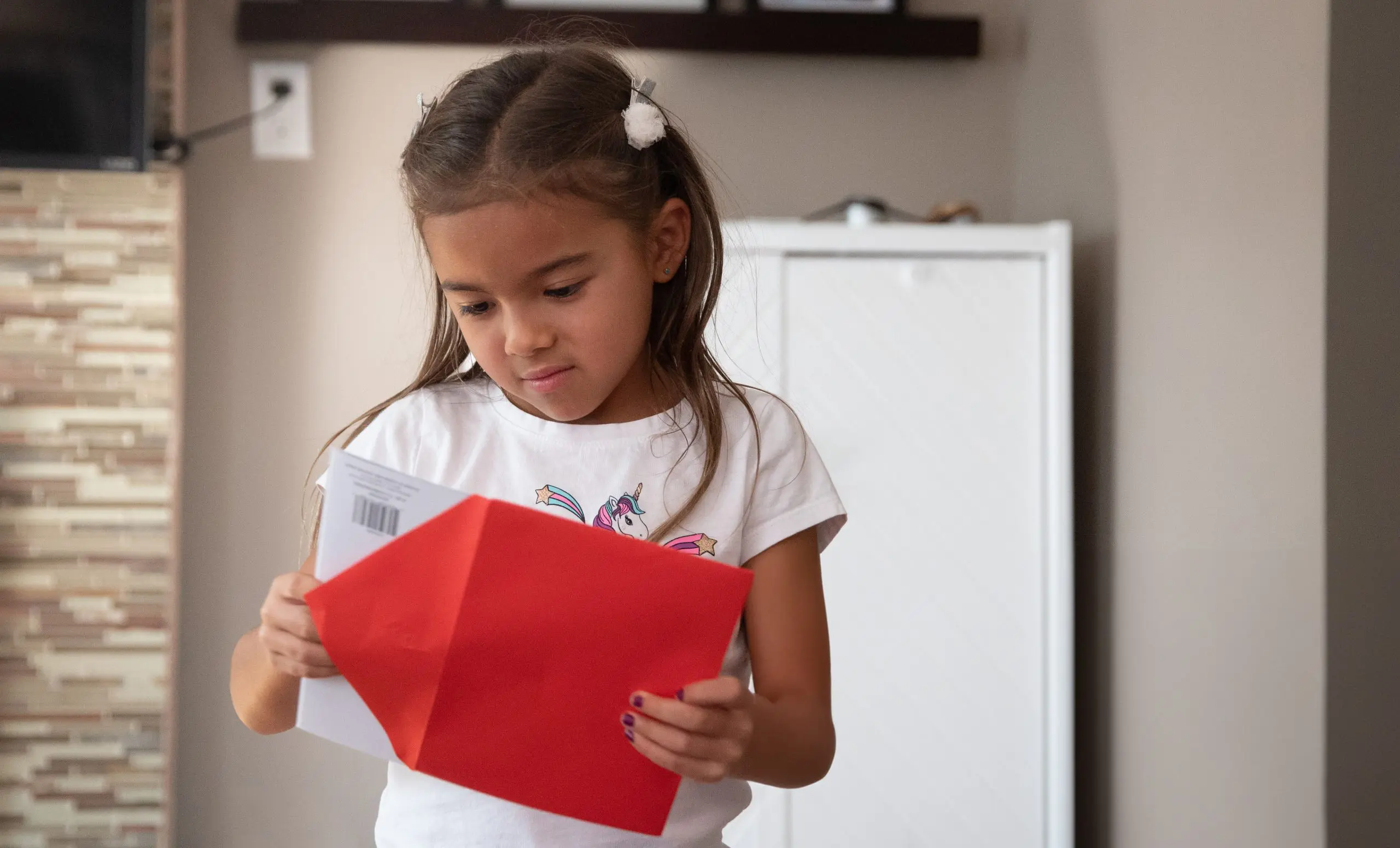 Child opening a greeting card