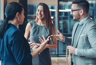 Corporate Page Payroll Giving Business people talking and laughing to represent Payroll Giving