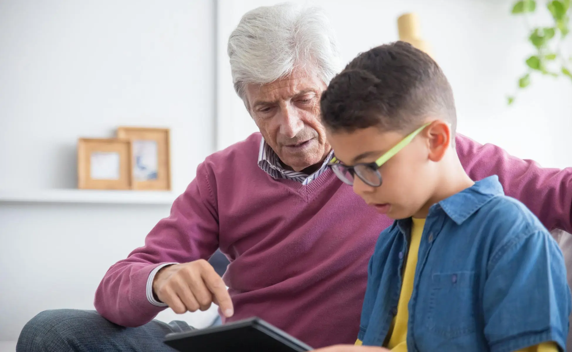 Grandfather helping his grandson