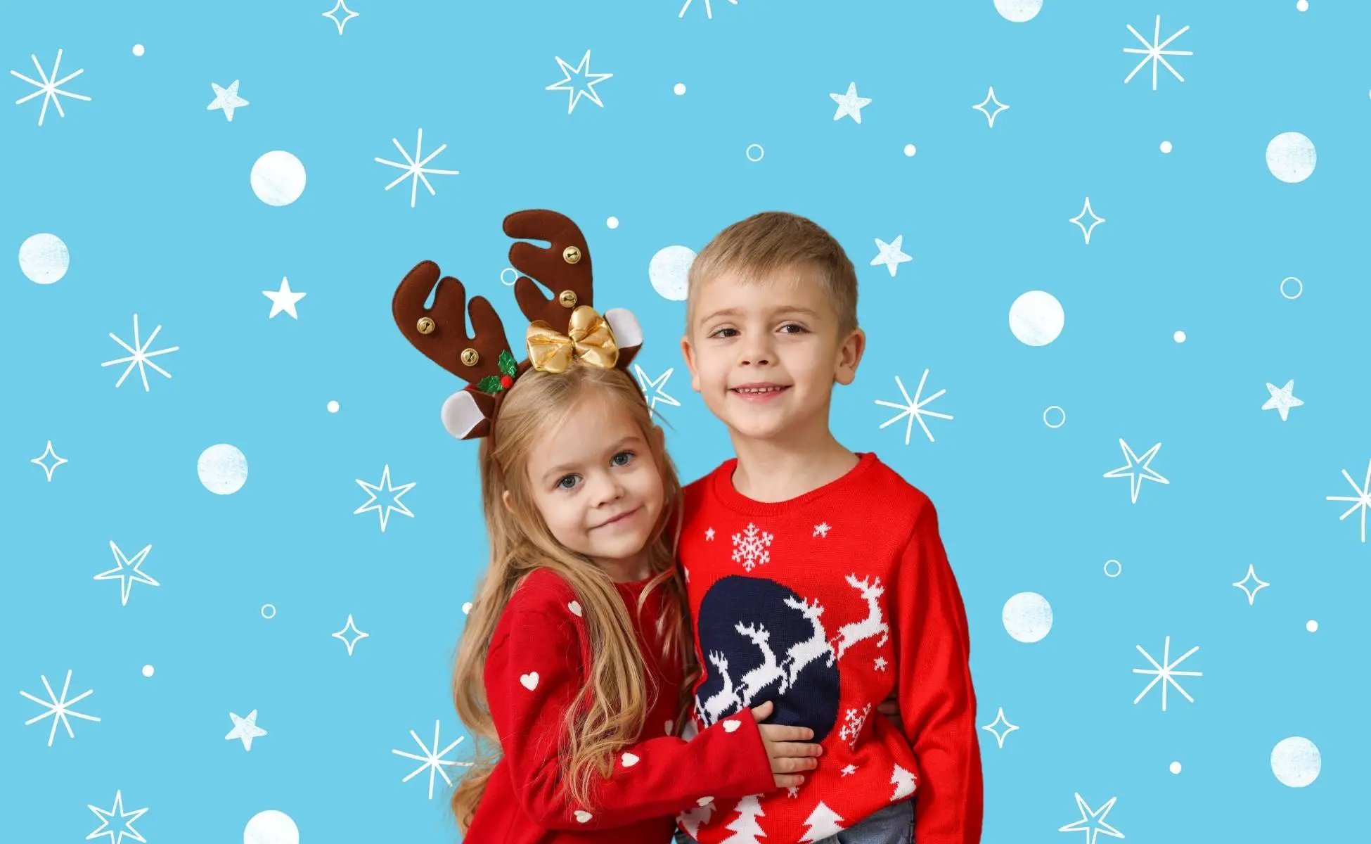 Two children in Christmas jumpers