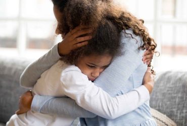 Mother and young daughter hugging - Managing separation anxiety in children after a bereavement - Winston's Wish