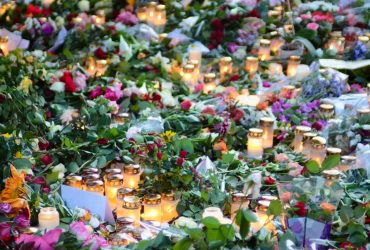 Talking to a child about death of a celebrity - Winston's Wish Flowers and candles laid as tribute to a celebrity
