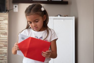 Child opening a greeting card